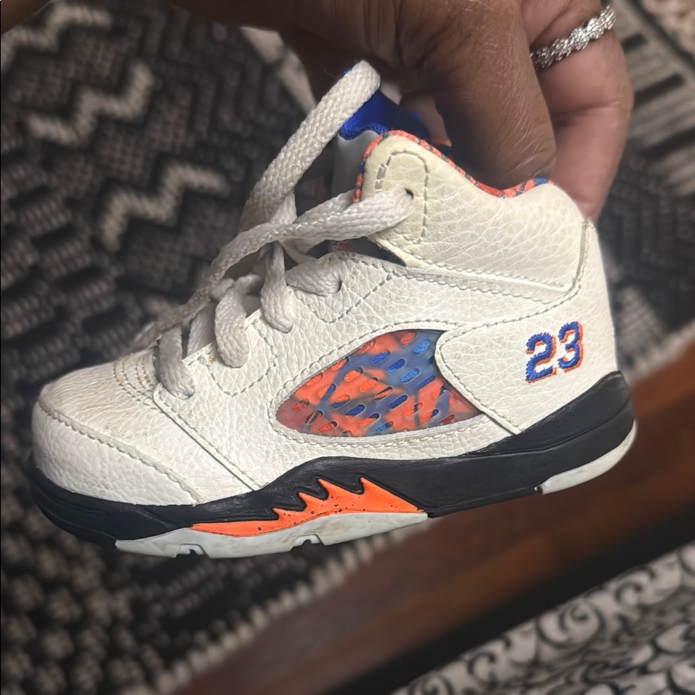 Jordan White and Orange Sneakers with Signature Design